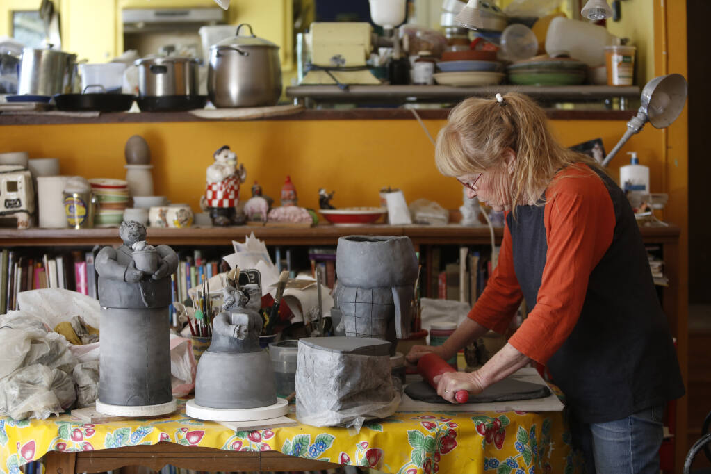 Artist and potter Cynthia Hipkiss works on a chef-themed cookie jar at her studio in Sonoma on Thursday, June 17, 2021. (Beth Schlanker/The Press Democrat)