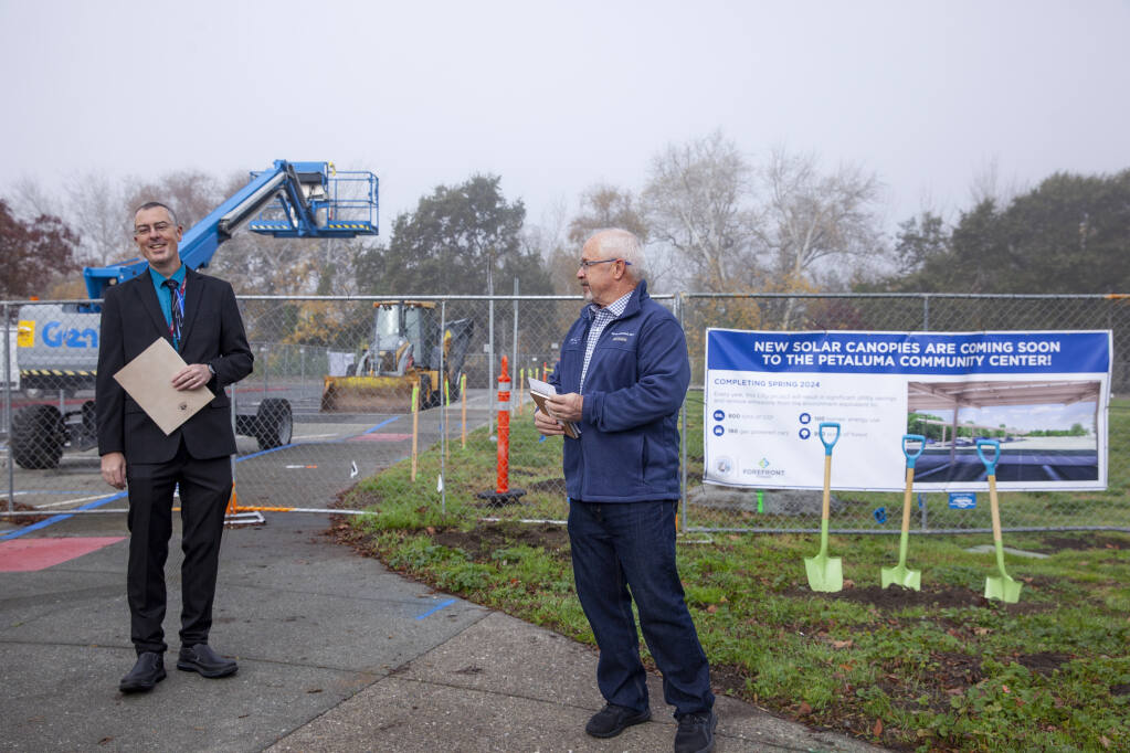 Mayor Kevin McDonnell (right), announces construction of a new solar panel project at the Community Center in Lucchesi Park while Assistant City Manager Patrick Carter (left) attends the event on Monday, December 4, 2023. (CRISSY PASCUAL/ARGUS-COURIER STAFF)