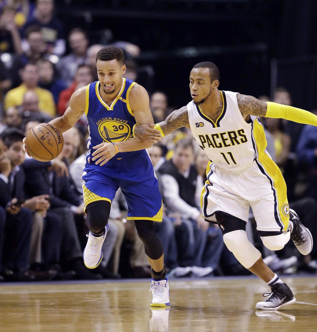 Golden State Warriors' Stephen Curry, left, is pursued by Indiana Pacers' Monta Ellis during the first half of an NBA basketball game Monday, Nov. 21, 2016, in Indianapolis. (AP Photo/Darron Cummings)