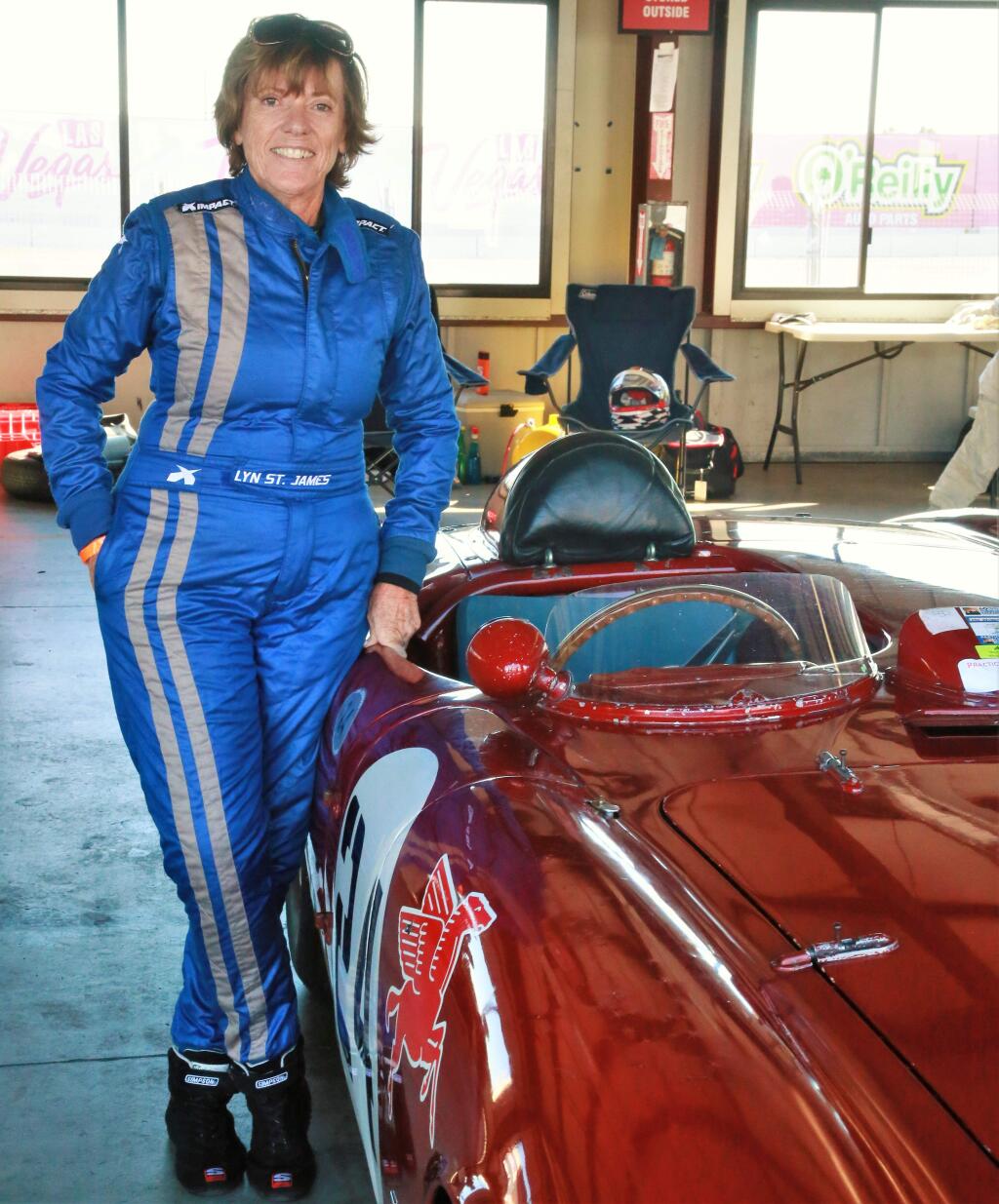 Lyn St. James, seven time Indianapolis 500 race driver poses for a photo with the 1954 Lancia D-24 before going out on the track to qualify at the Charity Challenge Vintage races at Sonoma Raceway, on Saturday Oct. 6, 2018. (Photo Will Bucquoy/ For the PD)