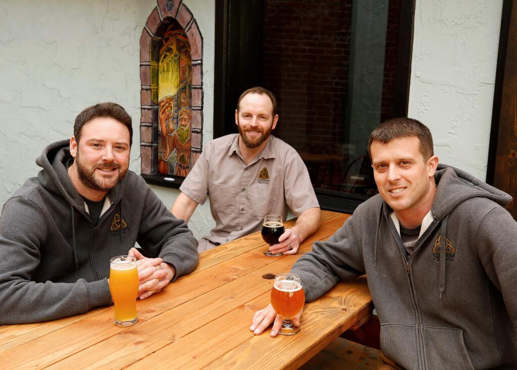 The co-founders of 3 Disciples Brewing, from left, James Claus, Matt Penpraze, and Luke Melo pose for a portrait at 3 Disciples Brewing in Santa Rosa, California, on Wednesday, February 6, 2019. (Alvin Jornada / The Press Democrat)