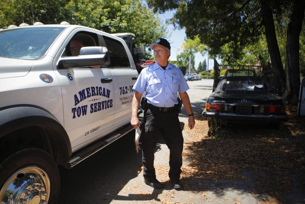 Petaluma, CA, USA. Tuesday, July 18, 2017._Tim Harmon, the Vehicle Abatement officer for the Petaluma Police Dept acts upon caller complaints about abandoned vehicles and then follows-up to see if they have been removed before issuing citations and calling for a tow truck. Cars can not be left parked on city streets for more than 72 hours. (CRISSY PASCUAL/ARGUS-COURIER STAFF)