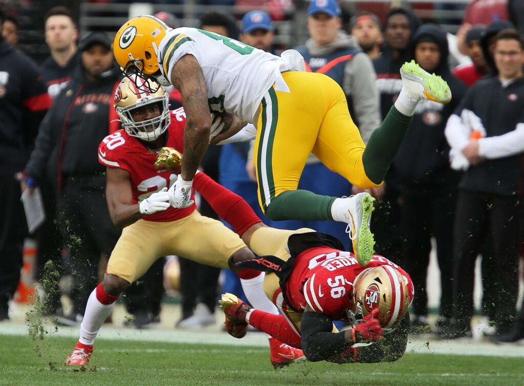 San Francisco 49ers middle linebacker Kwon Alexander tackles Green Bay Packers tight end Marcedes Lewis during their NFC Championship game at Levi's Stadium in Santa Clara on Sunday, January 19, 2020. The 49ers defeated the Packers 37-20.(Christopher Chung/ The Press Democrat)