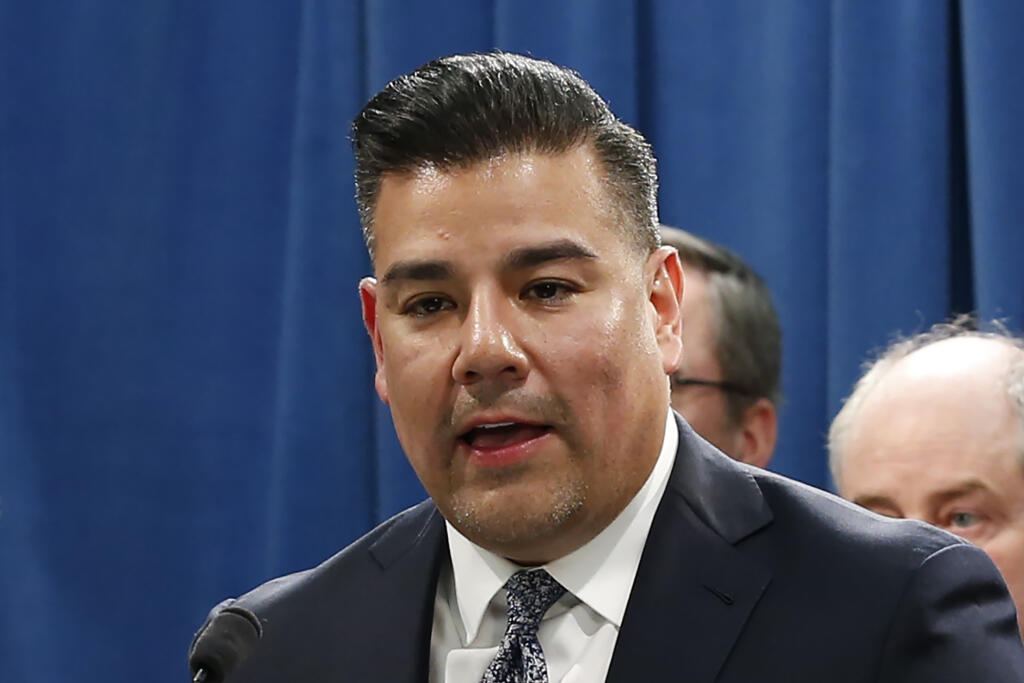 In this Tuesday, Feb. 18, 2020 file photo is California Insurance Commissioner Ricardo Lara at a state Capitol news conference in Sacramento, Calif. Lara has unveiled new rules requiring fire insurance carriers to provide discounts to homeowners who take mitigation steps. (Rich Pedroncelli/Associated Press, 2020)
