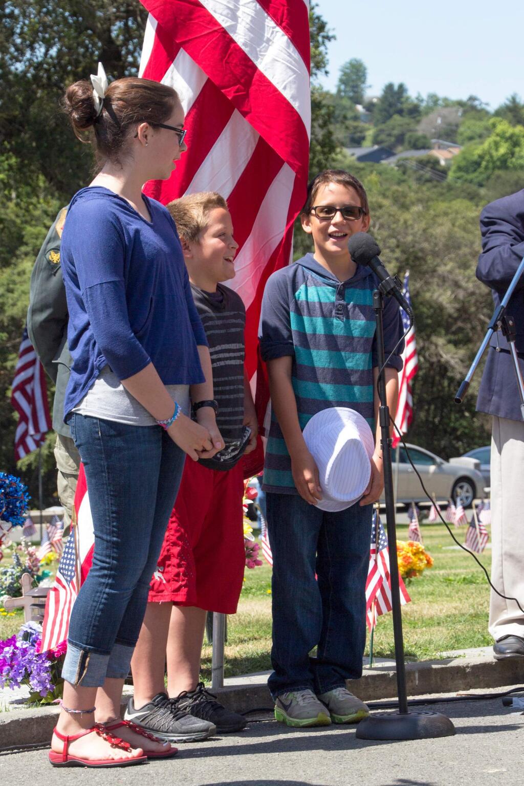 Students from Liberty Elementary School sing 'The Star Spangled Banner' at Petaluma's annual Memorial Day event, honoring all veterans, at Cypress Hill Memorial Park in Petaluma on the morning of Memorial Day on Monday May 30, 2016. (ASHLEY COLLINGWOOD/FOR THE ARGUS-COURIER)