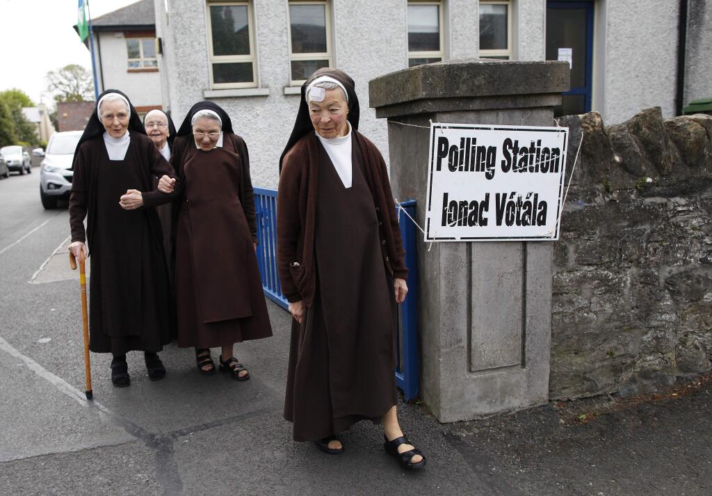 Carmelite sisters leave a polling station in Malahide, County Dublin, Ireland, Friday, May 22, 2015. Ireland began voting Friday in a referendum on Gay marriage which will require an amendment to the Irish constitution. (AP Photo/Peter Morrison)