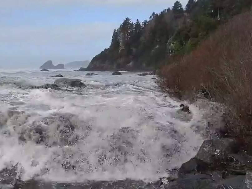 A screenshot from video posted to Facebook showing three people knocked off their feet at Moonstone Beach near Eureka, Saturday, Jan. 11, 2019. (MARCELLA OGATA-DAY/ FACEBOOK)