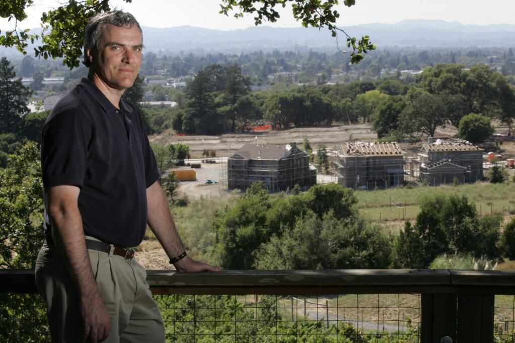7/31/2005: A15: Steve Osborn served on a citizens committee that helped plan development in southeast Santa Rosa. Osborn, whose family has lived in the area since the 1920s, overlooks some of the new construction.PC: Photo by Christopher Chung/ The Press Democrat Steve Osborn served on the Southeast Citizens Advisory Committee whose master plan was adopted in 1994. In the background, the Christopherson Homes Ragle Ranch subdivision is under construction.