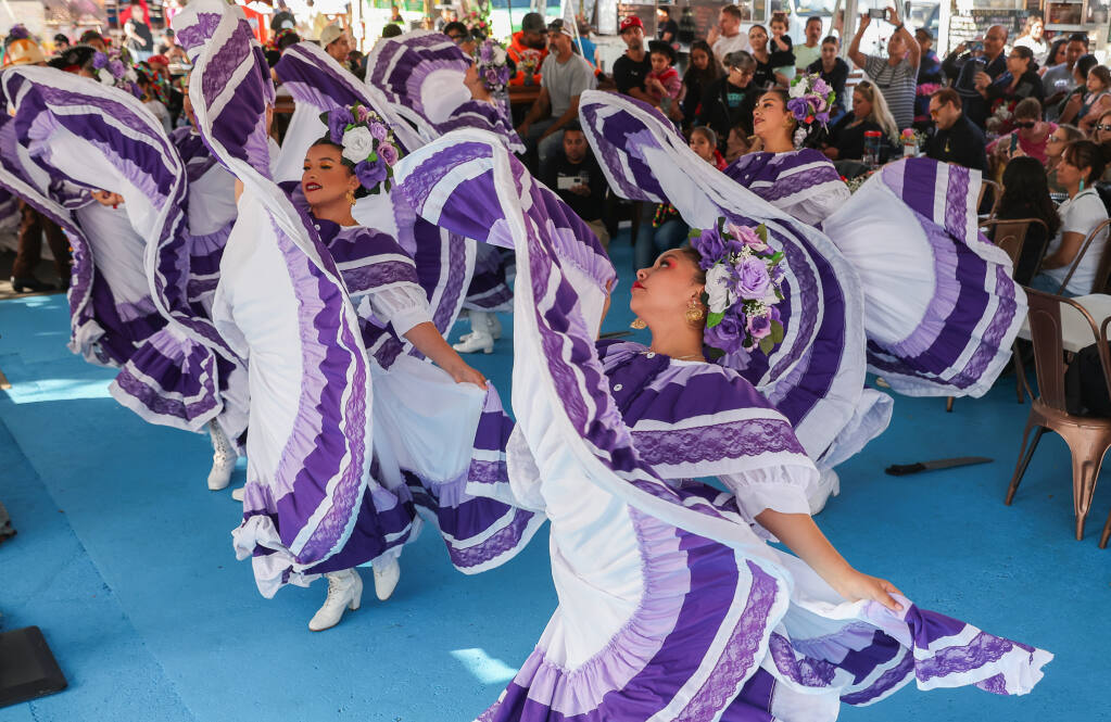 Ireri Ballet Folklorico Petaluma dancers perform during a party to celebrate the one-year anniversary of Mitote Food Park in the Roseland area of Santa Rosa on Thursday, June 15, 2023.  (Christopher Chung/The Press Democrat)