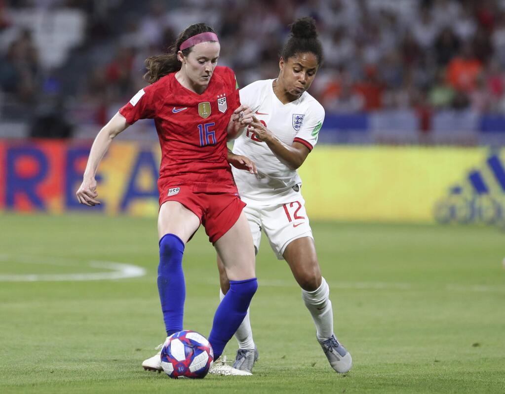 The United States' Rose Lavelle, left, and England's Demi Stokes challenge for the ball during the Women's World Cup semifinal game at the Stade de Lyon outside Lyon, France, Tuesday, July 2, 2019. (AP Photo/Laurent Cipriani)