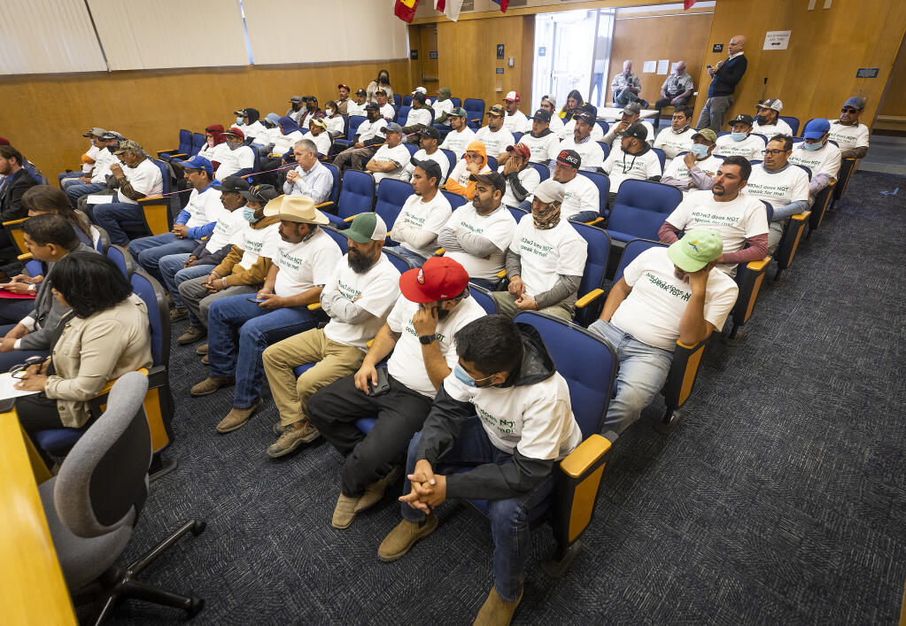 Farmworkers wearing matching “NBJwJ does NOT Speak for Me” T-shirts spoke about the need for fire evacuation plans and other protections Monday, May 3, 2022, at a Sonoma County Board of Supervisors meeting. (John Burgess / The Press Democrat)