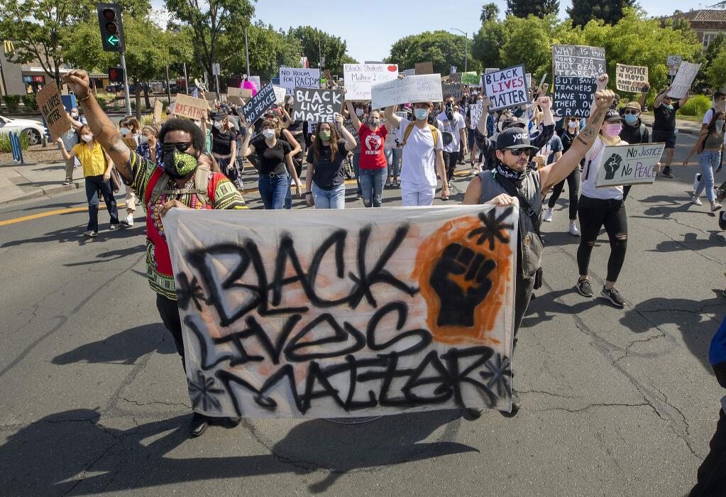 Black Lives Matter protesters marched down Mendocino Avenue to the county administration center in Santa Rosa on Friday afternoon, June 5, 2020. (photo by John Burgess/The Press Democrat).