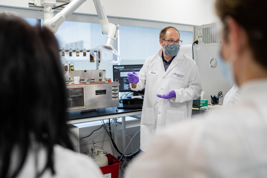 Jared Jackson, senior research associate II, provides a demonstration during a tour of Ultragenyx’s new research laboratory following the ribbon cutting ceremony at the facility on June 9, 2022.
