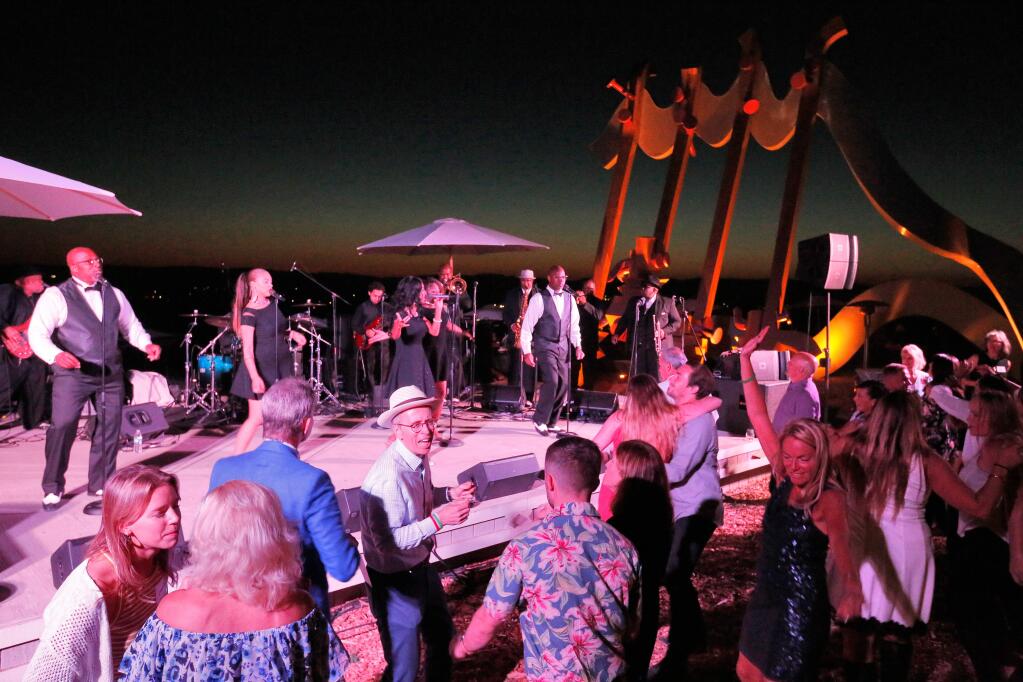 At the 2018 Sonoma County Wine Auction guests dance as Big Swing and the Ballroom Blasters perform during the 'Best Party Ever.' This year’s event was held online due to coronavirus shelter-in-place orders.  (Alvin Jornada / The Press Democrat)