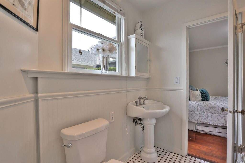 A pedestal sink and black and white tiles for a touch of vintage appeal. Property listed by Brent Mosbacher/ Coldwell Banker Residential Brokerage, coldwellbankerhomes.com, 415-897-3000. (Courtesy of BAREIS)