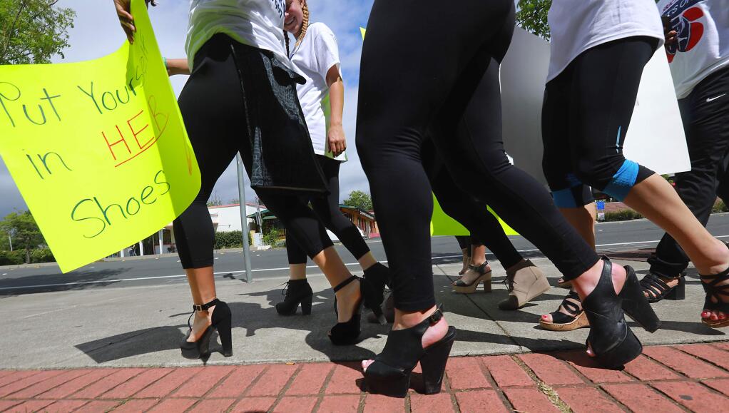 Over 200 SSU and SRJC students attended the 'Walk a Mile in Her Shoes' walk around the Santa Rosa campus on Wednesday afternoon in support of sexual assault prevention on college campuses. (John Burgess/The Press Democrat)