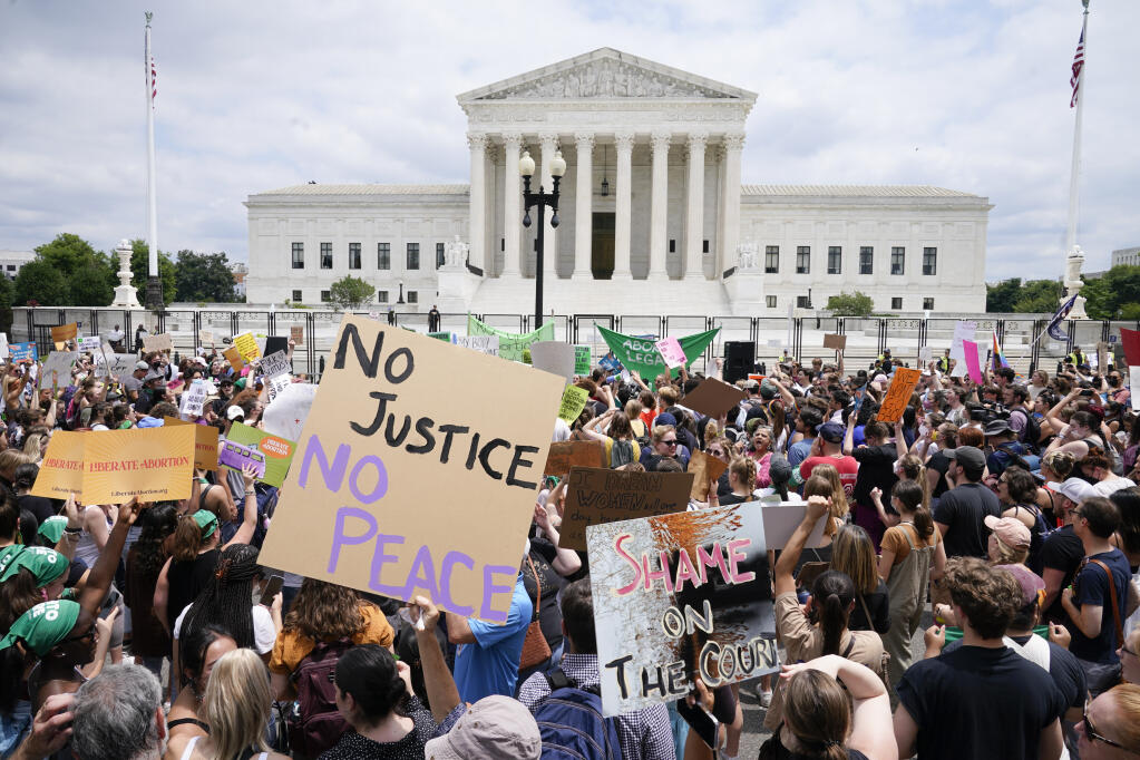 Protesters gather outside the Supreme Court in Washington, Friday, June 24, 2022. The Supreme Court has ended constitutional protections for abortion that had been in place nearly 50 years, a decision by its conservative majority to overturn the court's landmark abortion cases. (AP Photo/Jacquelyn Martin)
