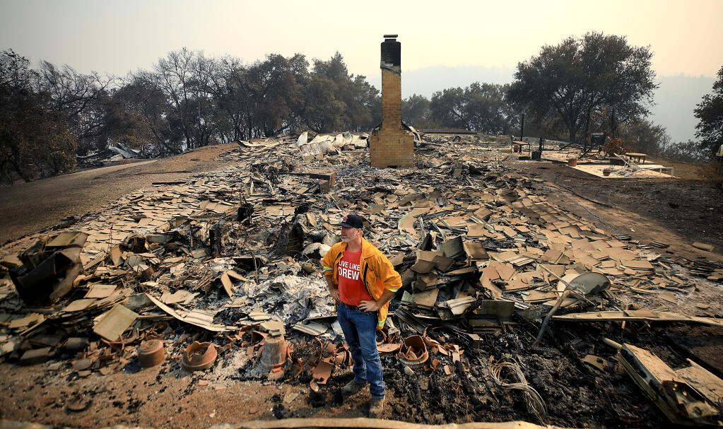 Sonoma County Supervisor James Gore checks on a property for a friend off Mill Creek Road, Sunday, Aug. 23, 2020, that was burned during the Walbridge fire. (Kent Porter / The Press Democrat)