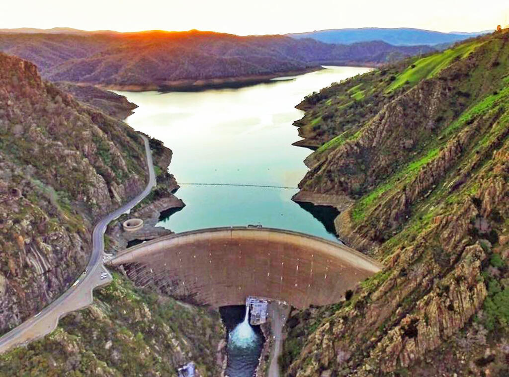 Built between 1953 and 1957, the Monticello Dam backing up Lake Berryessa is a 304-foot-high, 1,023-foot-wide concrete arch dam in Napa County. The dam is the seventh-largest man-made lake in California. It impounds Putah Creek creating a recreational surface area of 20,700 acres in the Vaca Mountains. The lake contains 1.6 million acre-feet of water encompassing a 556-square-mile catchment area. The dam's hydroelectric output is 11.5 megawatts. Water from the reservoir primarily supplies agriculture in the Sacramento area downstream. (courtesy photo)