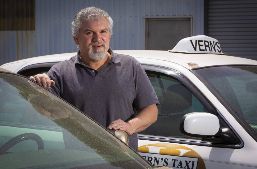 Marc Gardella, the current proprietor of Vern's Taxi, at his shop and yard on First Street East. (Photo by Robbi Pengelly/Index-Tribune).