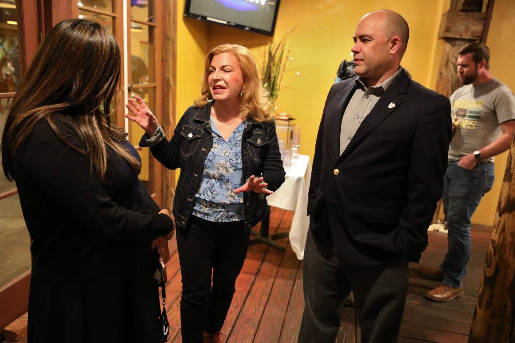 Sonoma County Supervisor Shirlee Zane, center, talks with Windsor Town Council member Esther Lemus, left, and Chris Snyder at her election night campaign party in Santa Rosa on Tuesday, March 3, 2020. (Christopher Chung/ The Press Democrat)
