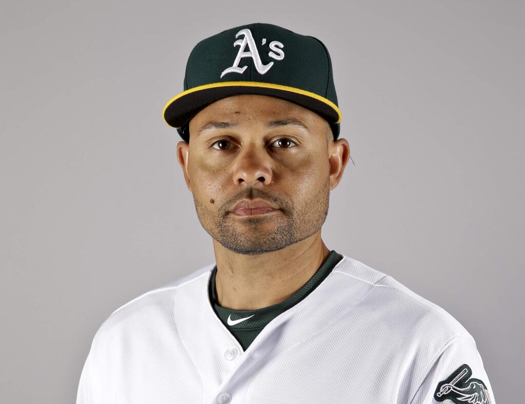 FILE - This is a Feb. 29, 2016, file photo, showing Coco Crisp of the Oakland Athletics baseball team. The Cleveland Indians have bolstered their outfield depth by acquiring Coco Crisp in a trade with the Oakland Athletics. The AL Central leaders sent minor league pitcher Colt Hynes and cash to the A's for Crisp, who began his career with Cleveland in 2002. The 36-year-old gives the club another switch-hitter, more speed and postseason experience. (AP Photo/Chris Carlson, File)