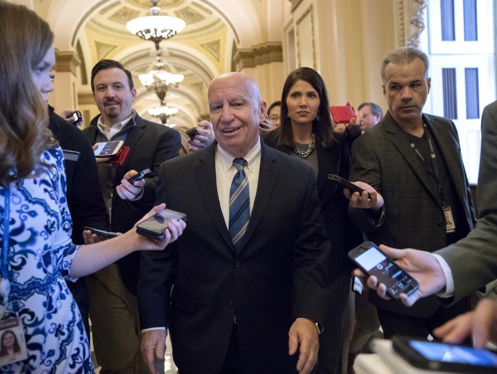 House Ways and Means Committee Chairman Kevin Brady, R-Texas, talks to reporters in the Capitol as House Republicans prepare to advance the GOP tax bill, in Washington, Friday, Dec. 15, 2017. (AP Photo/J. Scott Applewhite)