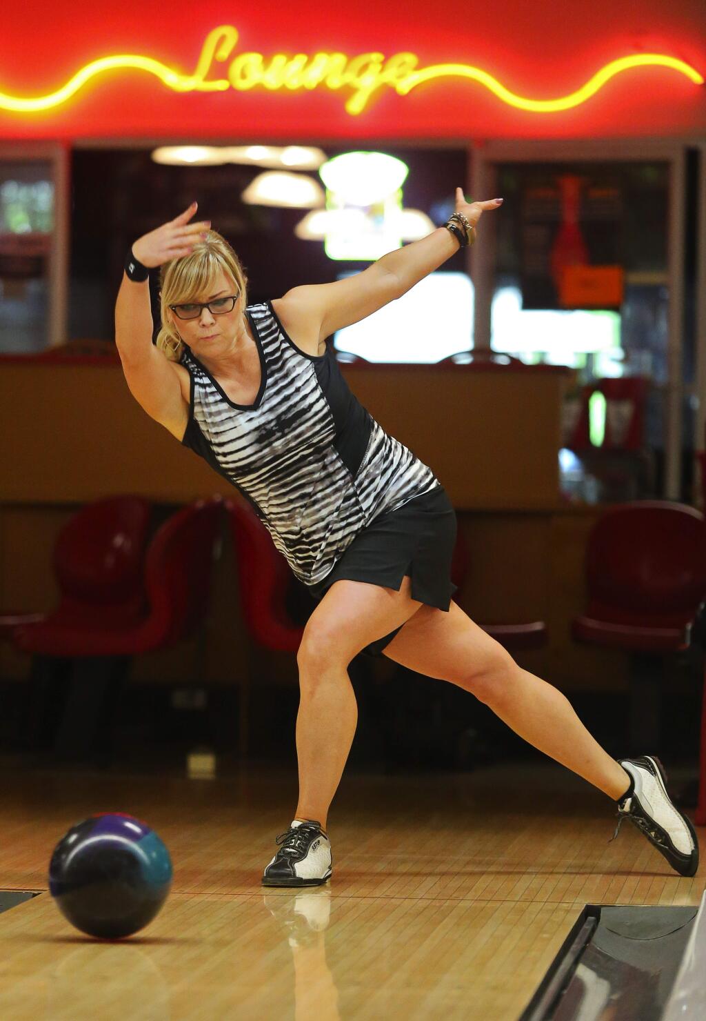 Julie Yokoyama bowls at Double Decker Lanes in Rohnert Park, on Friday, April 29, 2016. Yokoyama is entered to compete in the Nationwide PWBA Sonoma County Open on May 5-8.(Christopher Chung/ The Press Democrat)