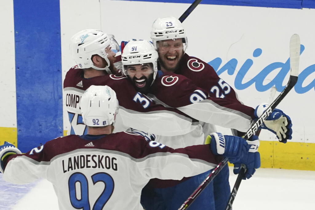 Colorado Avalanche center Nazem Kadri is congratulated by teammates after his overtime goal on Lightning goaltender Andrei Vasilevskiy in Game 4 of the Stanley Cup Final on Wednesday, June 22, 2022, in Tampa, Florida. (John Bazemore / ASSOCIATED PRESS)