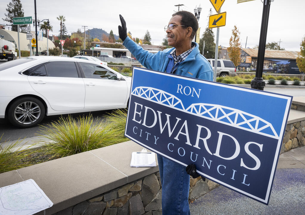 Healdsburg city council candidate Ron Edwards waves to potential voters Friday, Nov. 4, 2022, at the Healdsburg Avenue roundabout. (John Burgess/The Press Democrat)