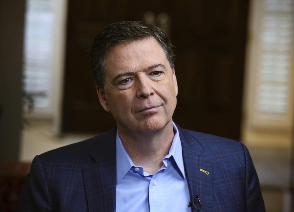 In this image released by ABC News, former FBI director James Comey appears at an interview with George Stephanopoulos that will air during a primetime '20/20' special on Sunday, April 15, 2018 on the ABC Television Network. Comey's book, 'A Higher Loyalty: Truth, Lies, and Leadership,' will be released on Tuesday. (Ralph Alswang/ABC via AP)