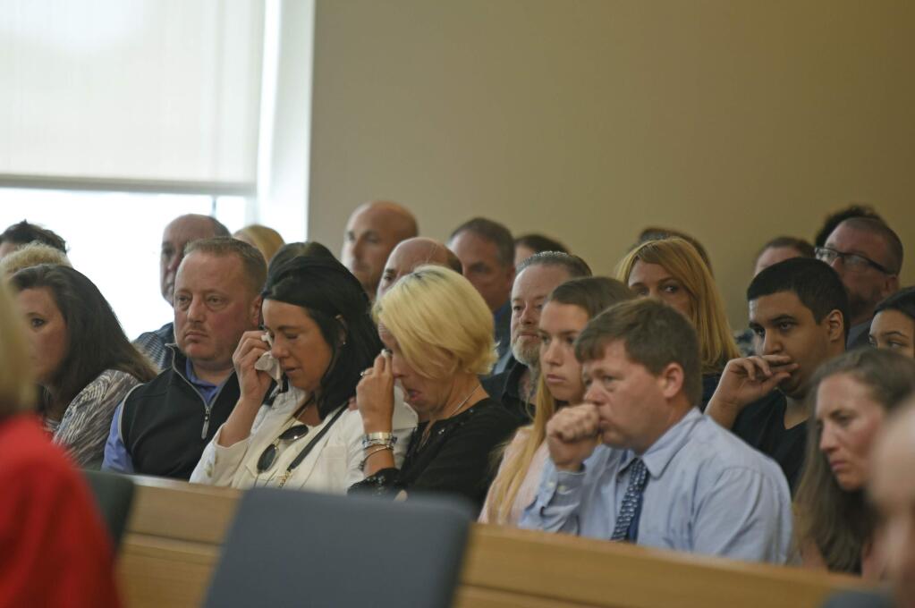 Friends and family members of Conrad Roy III listen as Judge Lawrence Moniz announces his verdict on Friday, June 16, 2017, in Bristol Juvenile Court in Taunton, Mass. Michelle Carter was found Guilty of involuntary manslaughter in the suicide of Roy. (Glenn C.Silva/Fairhaven Neighborhood News, Pool)