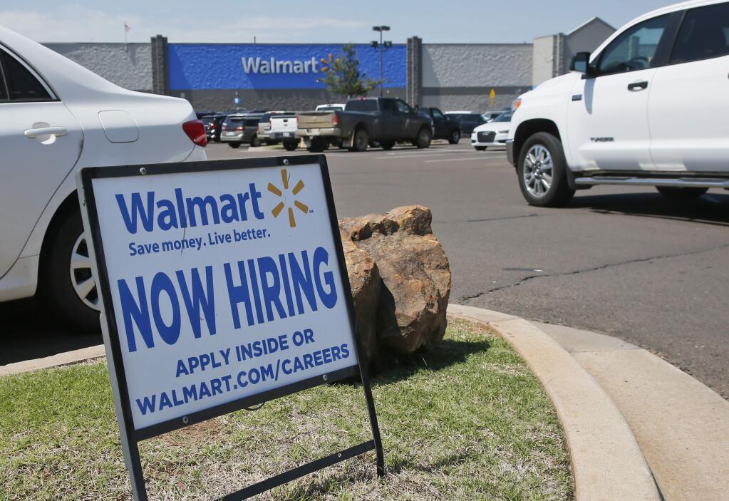 This Tuesday, May 30, 2017, photo shows a sign in the parking lot of a Walmart announcing that the store is hiring, in Oklahoma City. On Tuesday, July 11, 2017, the Labor Department reports on job openings and labor turnover for May. (AP Photo/Sue Ogrocki)