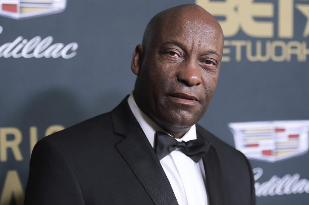 FILE - In this Sunday, Feb. 25, 2018 file photo, John Singleton attends the 2018 American Black Film Festival Honors at the Beverly Hilton Hotel in Beverly Hills, Calif. In April, Hollywood lost director John Singleton, whose 1991 film 'Boyz N the Hood' was praised as a realistic and compassionate take on race, class, peer pressure and family. He became the first black director to receive an Oscar nomination and the youngest at 24. (Photo by Richard Shotwell/Invision/AP, File