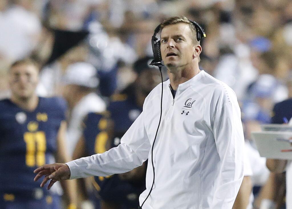 In this Sept. 8, 2018, file photo, Cal coach Justin Wilcox looks at the scoreboard during the first half of the team's game against BYU in Provo, Utah. The Golden Bears are looking for a boost in their game against Oregon State in Corvallis, Ore., Saturday, Oct. 20, 2018, after a three-game losing streak and a demoralizing loss to UCLA last weekend. (AP Photo/Rick Bowmer, File)