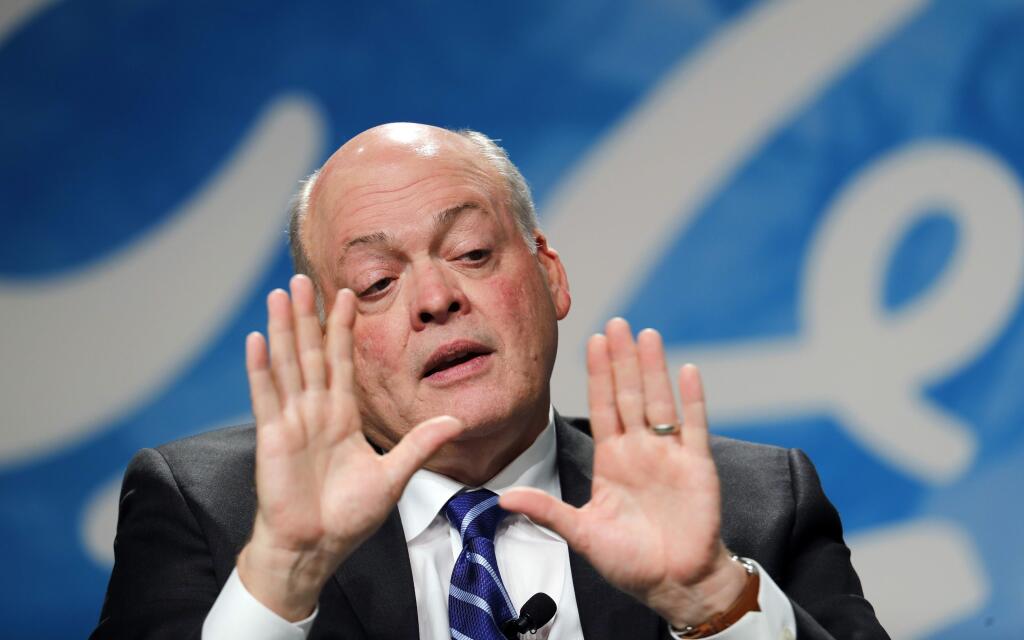 FILE - In this Monday, May 22, 2017, file photo, Ford Motor Co. CEO Jim Hackett speaks after being introduced as the automaker's new chief executive in Dearborn, Mich. Hackett says the company isn't taking its eyes off the present as it prepares for transportation in the future. (AP Photo/Paul Sancya, File)