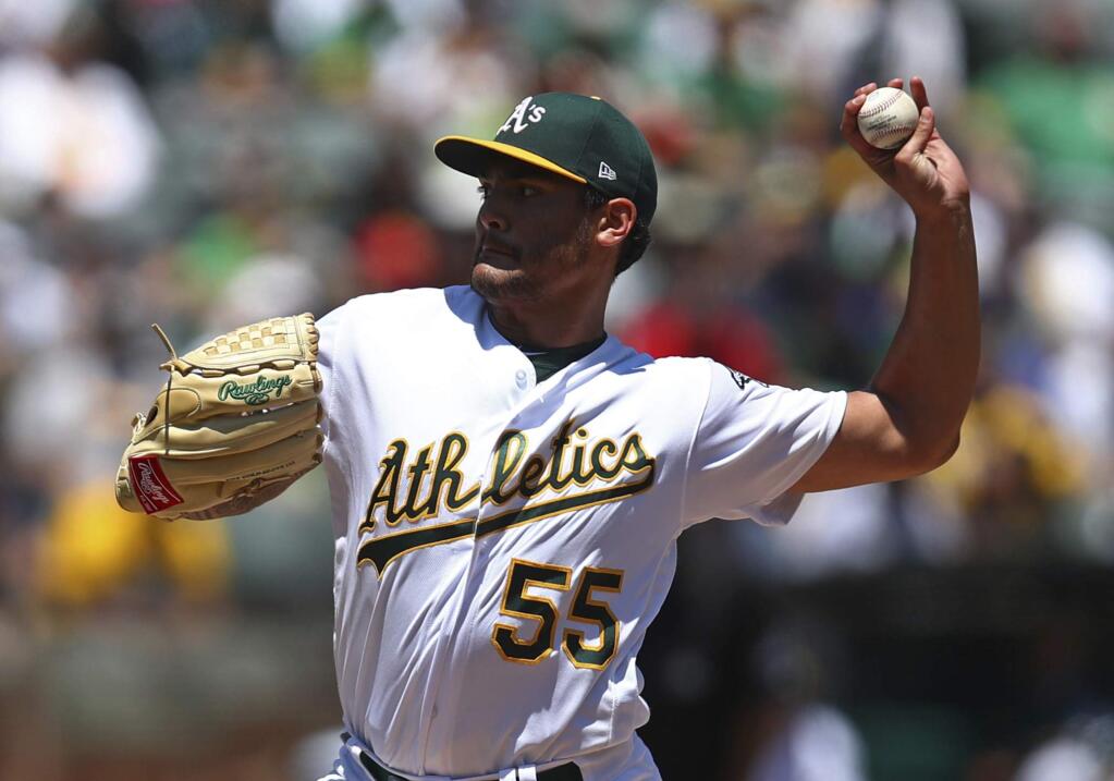 Oakland Athletics pitcher Sean Manaea works against the San Francisco Giants in the first inning of a baseball game Sunday, July 22, 2018, in Oakland, Calif. (AP Photo/Ben Margot)