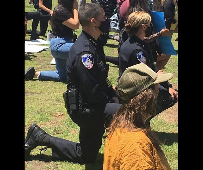 Santa Rosa Police Chief Ray Navarro and other members of the police department's leadership team took a knee in solidarity during the youth protest in Old Courthouse Square in Santa Rosa over the Minneapolis in-custody death of George Floyd on Monday, June 1, 2020. (Santa Rosa Police Department/Facebook)