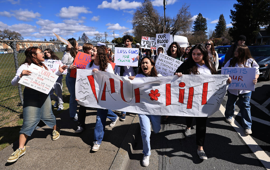 Santa Rosa High School students march toward the Santa Rosa City Schools Administration building during a citywide student walkout March 8, 2023, in a coordinated response to violent  school incidents, including the stabbing death of Jayden Pienta March 1 at Montgomery High School in Santa Rosa. (Kent Porter / The Press Democrat)