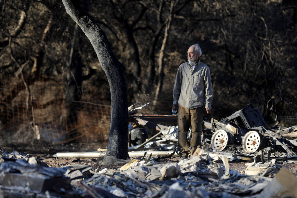 Rick Kavinoky stands overlooking the ruins of his home that burned during the Glass fire at Monan's Rill near Santa Rosa, on Wednesday, Oct. 21, 2020. (Beth Schlanker / The Press Democrat)