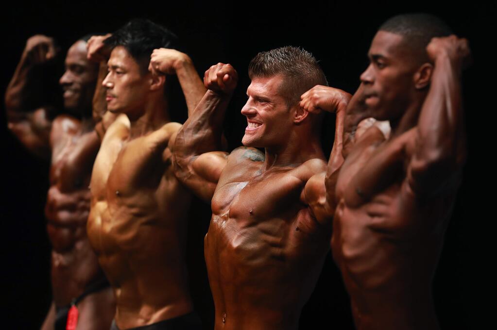 From left, William Robinson, Jaegeun Kim, Stephen Butterfield and Lorenzo Elder compete in the Pro division at the 2017 NGA Natural Olympian Pro/Am at the Spreckles Center in Rohnert Park on Saturday. (photo by John Burgess/The Press Democrat)