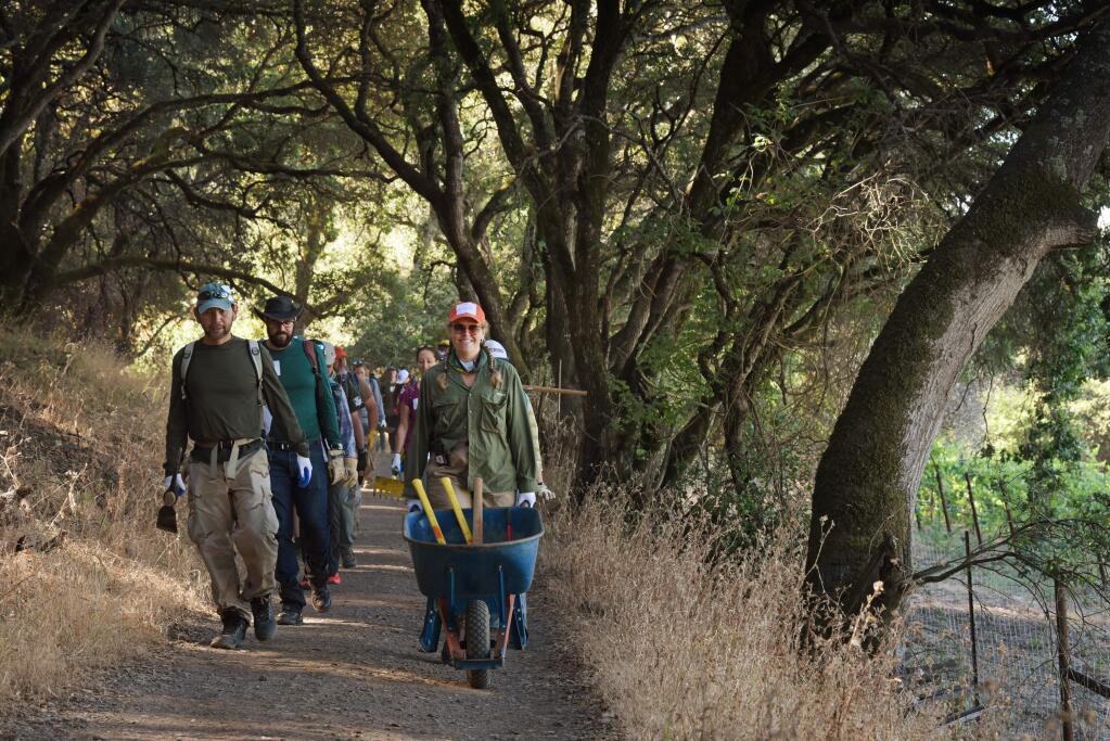 A group of Volunteers for Outdoor California heading out to do some repair work from winter storm damage and erosion maintenance on the Creekside Trail on Saturday at Shiloh Ranch Regional Park in Windsor, California. July 13, 2019.(Photo: Erik Castro/for The Press Democrat)