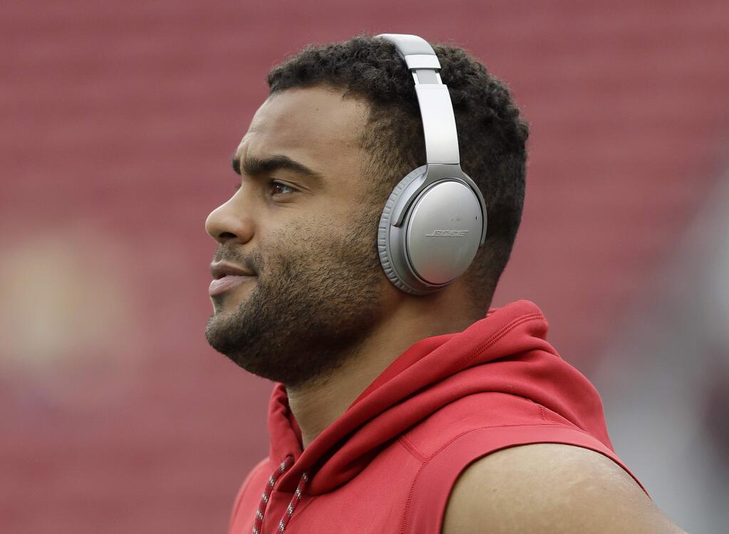 In this Dec. 24, 2017, file photo, San Francisco 49ers defensive end Solomon Thomas warms up before the team's game against the Jacksonville Jaguars in Santa Clara. Thomas will return to his family's home in the Dallas area this weekend to take part Saturday in The Out of the Darkness Overnight Walk, which benefits the American Foundation for Suicide Prevention. Thomas has already raised more than $27,000 for the cause. (AP Photo/Marcio Jose Sanchez, File)
