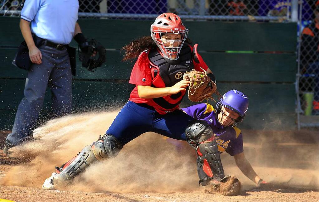 Rancho Cotate's Carolina Camacho forces out Ukiah's Anna Brazil at home plate with the bases loaded in the 1st inning. (JOHN BURGESS / Sonoma Magazine)