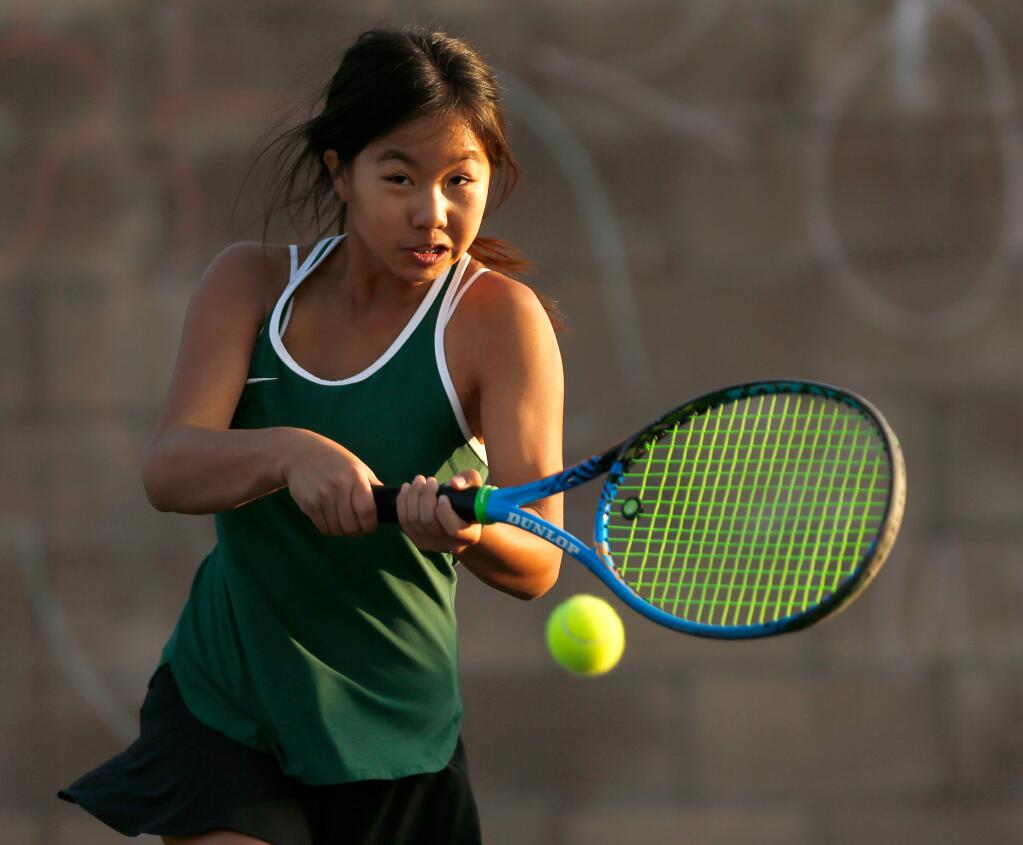 Maria Carrillo's Teresa Liang hits a two-handed volley during the 2017 North Bay League tennis doubles championship tournament in Santa Rosa. (Alvin Jornada / The Press Democrat)