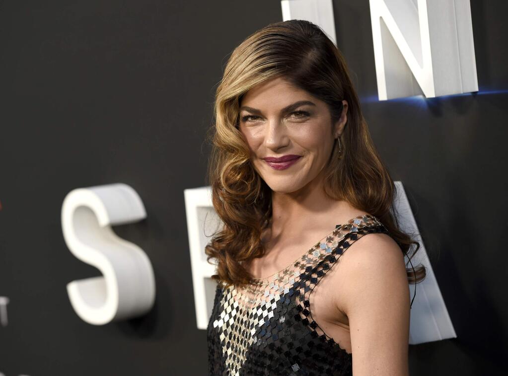 FILE - In this April 9, 2018 file photo, Selma Blair arrives at the Los Angeles premiere of 'Lost in Space' at the ArcLight Cinerama Dome. The film and TV actress has announced she is dealing with a diagnosis of multiple sclerosis. In a post Saturday, Oct. 20, 2018 on her Instagram account, Blair, 46, says she was diagnosed with the disease of the central nervous system on Aug. 16. (Photo by Chris Pizzello/Invision/AP, File)