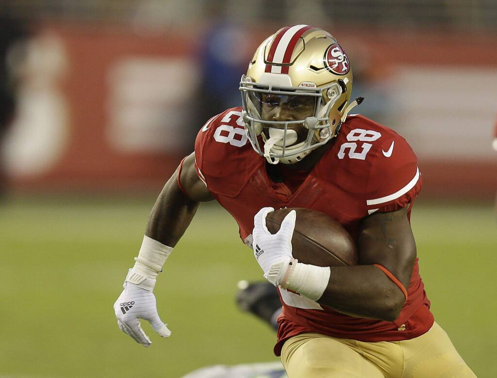 49ers running back Carlos Hyde has thrived when carrying the ball out of the shotgun formation, which is Chip Kelly's preferred style of offense. (Ben Margot / Associated Press)
