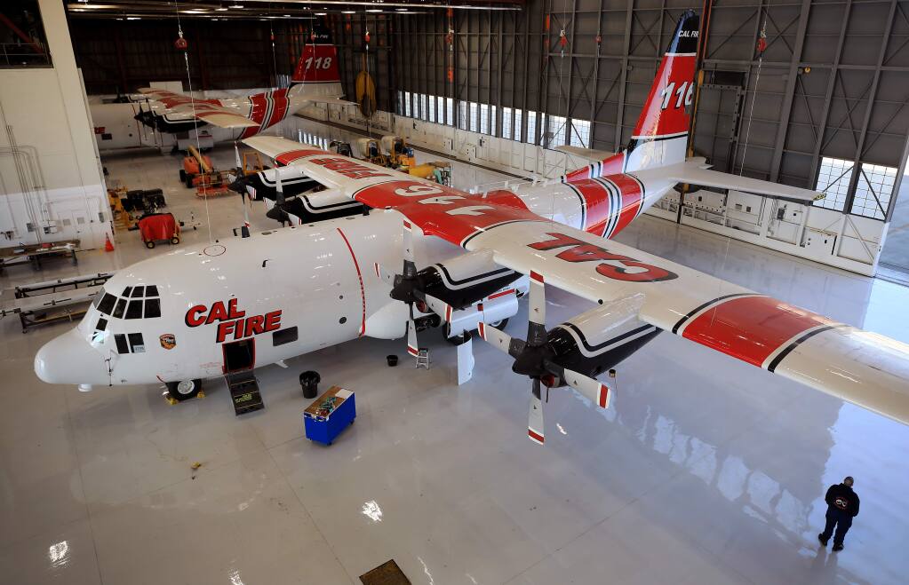 Two Lockheed Hercules C-130 Cal Fire airtankers are based at the Cal Fire tanker base at McClellan Airfield in Sacramento, Wednesday, Feb. 12, 2020. The aircraft will be used in the future to supplement the state's smaller S2-T fleet. The C-130's can drop 4,000 gallons of retardant on a fire, two times more than the smaller aircraft. (Kent Porter / The Press Democrat) 2020