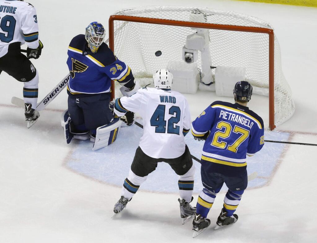 San Jose Sharks right wing Joel Ward (42) gets the puck past St. Louis Blues goalie Jake Allen (34) for a score during the second period in Game 5 of the NHL hockey Stanley Cup Western Conference finals, Monday, May 23, 2016, in St. Louis. (AP Photo/Jeff Roberson)