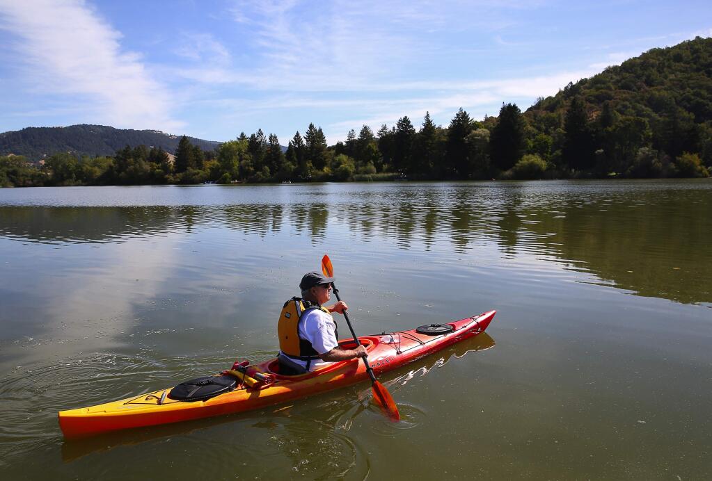 WARM WEATHER FUN: Gene Fanucchi, of Petaluma, paddles his kayak around Spring Lake in Santa Rosa, on Friday, September 2, 2016. (Christopher Chung/ The Press Democrat)
